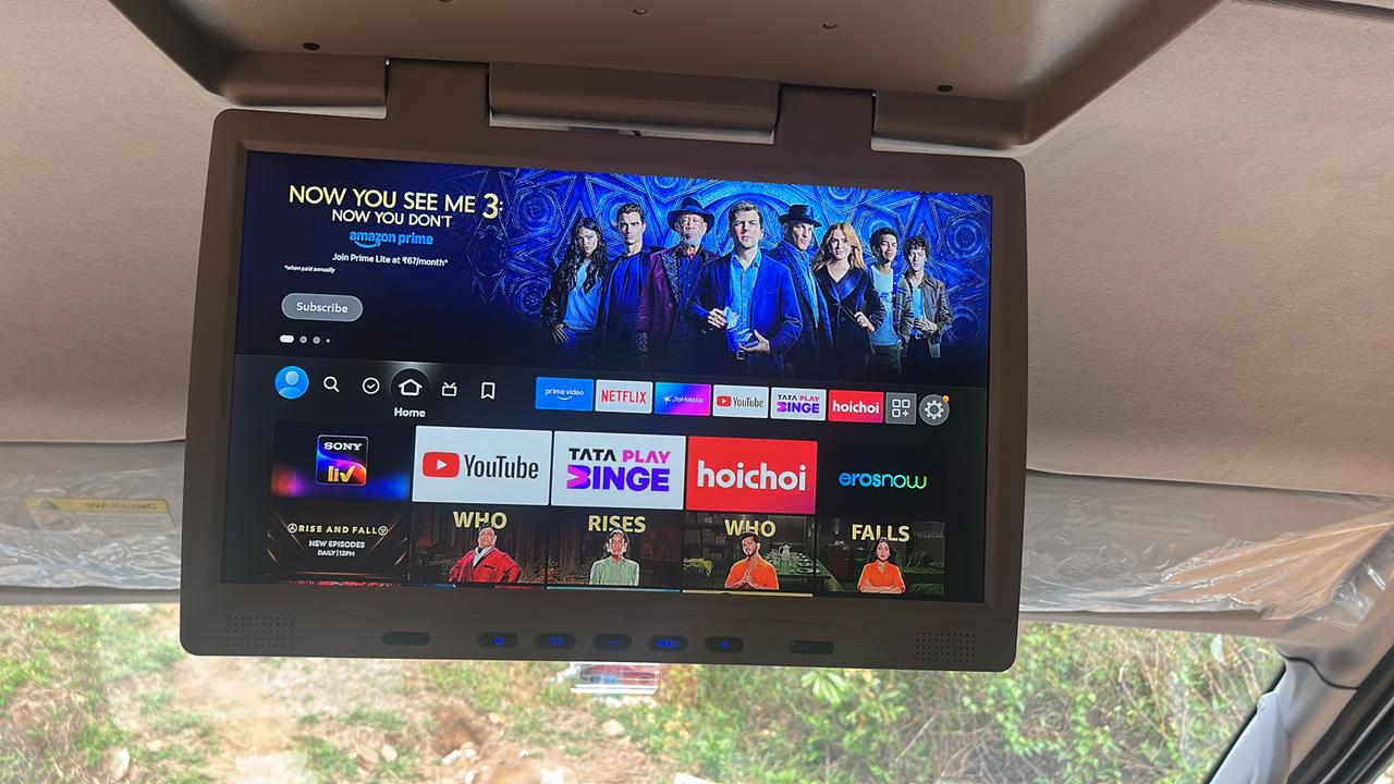 Roof-mounted entertainment screen inside the Tempo Traveller